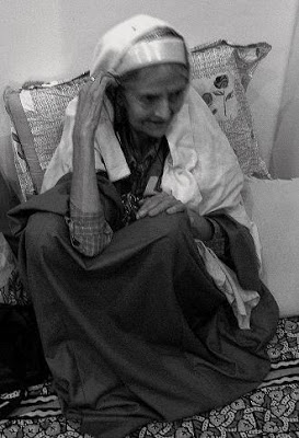 old lady in traditional Kashmiri pandit dress: Tarang, pheran, 
