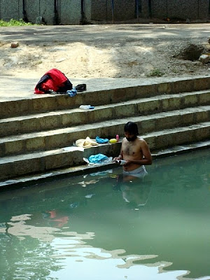 pandit pilgrim in river at Kheer bhawani kashmir